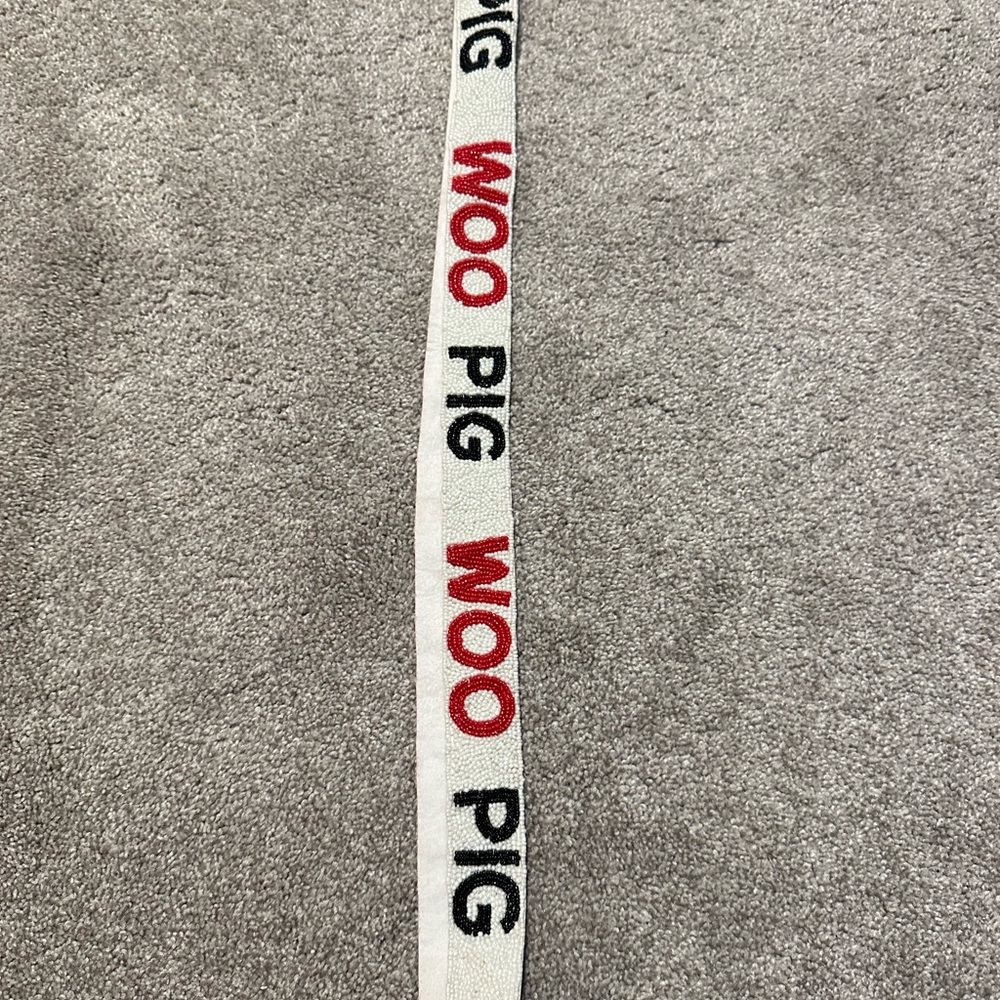 WOO PIG Knit Logo Strap in White with Red and Black Text
